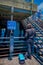 Los Angeles, California, USA, JUNE, 15, 2018: Man close to an informative sign on a metallic blue structure of recycle