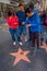 Los Angeles, California, USA, JUNE, 15, 2018: Outdoor view of family taking a picture of a Donald Trump fame star in