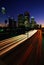 Los Angeles skyline with streaked freeway lights