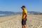 LOS ANGELES, VENICE BEACH, USA - JULY 06, 2018, early morning, a young man stands on the beach of Venice, some people have a rest