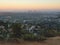 Los Angles City at sunset with hill foreground, California, USA