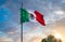 Los Cabos, Mexico, Mexican tricolor national striped flag proudly waving at mast in the air with Aztec symbol for