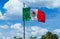 Los Cabos, Mexico, Mexican tricolor national striped flag proudly waving at mast in the air with Aztec symbol for