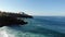 Los Gigantes cliffs and overlooking the ocean from the beach. Morning on the island of Tenerife. Atlantic waves and volcanic beach