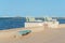 LOS NIETOS, SPAIN - 19 SEPTEMBER 2022 Seahorse sculptures on the shore of the Mar Menor lagoon, with the resort of La Manga on