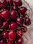 Ð¡lose-up of cherry berries with cuttings in a glass bowl