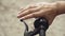 Lose up female hand on bicycle handlebar. Close Up Bicycle Rider Hands. Woman Holding Bicycle Brake. Modern healthy