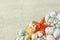 Lose up of starfish and seashells on white sand background with