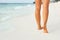 Ð¡lose up of woman leg on the beach. Woman  feet walking on the sand. Foot female