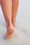 Ð¡lose up of woman leg on the beach. Woman  feet walking on the sand. Foot female.Skin Care.