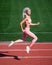 lose weight. speed and energy. stamina. sexy runner in fitness sportswear. sprinting on outdoor arena racetrack
