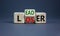 From loser to leader symbol. Turned wooden cubes and changed the word `loser` to `leader`. Beautiful grey background. From los