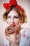 Ð¡loseup portrait of beautiful blond young woman with excellent dental care teeth having fun eating donut and happy smiling