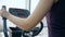 Losing weight, female on Elliptical trainers in sports Complex