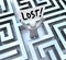 Lost Man Holding Sign in Labyrinth Maze