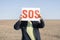 a lost person in the desert, man having problem in trouble, search the the destination, sos sign