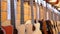 Lot of acoustic guitars hanging in a music store. Shop musical instruments.