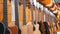 Lot of Acoustic Guitars Hanging in a Music Store. Shop musical instruments.