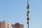 A lot of birdhouses on a long high pole