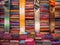 Lot of colorful traditional Moroccan scarves and shawls in a market