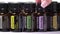 A lot of different Doterra essential oils in bottle rotating on white background