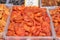 A lot of dried apricots on the market stall close-up, texture and background
