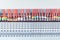 Lot electrical feedthrough terminals, arranged in a row.