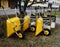 Lot of empty new yellow garden wheelbarrows in the yard