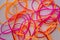 Lot of entangled bright and colorful rubber bands