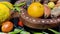 A lot of fruits and vegetables with a wooden bowl over the table