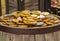 A lot of gold coins on a wooden barrel, the concept of wealth