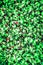 a lot of green sweet cola bottle candies a background