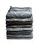 Lot of grey used jeans stacked in a pile isolated on white