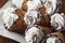 A lot of ice cream cones on wooden table. Soft ice creams or frozen custard in cones