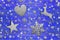 Lot of iron star, heart, dear and snowflake on weathered blue wooden board