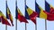 A lot of national flags of Romania winding on a blue sky background