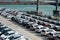 A lot of new cars toyota corolla and Subaru Forester are unloaded at the seaport