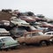 A lot of old cars lying on top of each other, a dump, auto recycling,