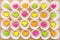 A lot of paper colorful origami heart in round white cupcake molds. Modern bright romantic background. Origami paper hearts