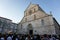 A lot of people stand in front of the church and listen to the Holy Mass. Celebration of Saint Mary Day in the Croatian town of