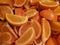 lot of pieces of orange fruit, background and texture