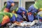 Lot of rainbow lorikeet birds eating bread with a blurred background