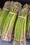 A Lot raw bunches of asparagus. Close up of green, fresh asparagus. Farmers market concepts