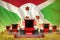 A lot of red farming combine harvesters on farm field with Burundi flag background - front view, stop starving concept -