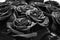 A lot of roses . Closeup, selective focus. Black and white photography