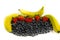 Lot`s of blueberry`s and red strawberry`s with three yellow and green banana`s