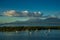 A lot of sailboats in a calm water with mountain and clouds on background at the Guadalupe