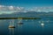 A lot of sailboats in a calm water with mountain and clouds on background at the Guadalupe