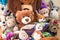 Lot of Soft plush toys sits on floor in the children`s room