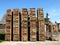 Lot of storage boxes with firewood in a factory at daytime